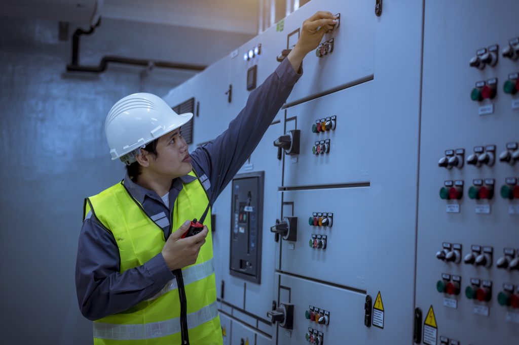Engineer checking and inspecting at MDB panel .they working with electric switchboard to check range